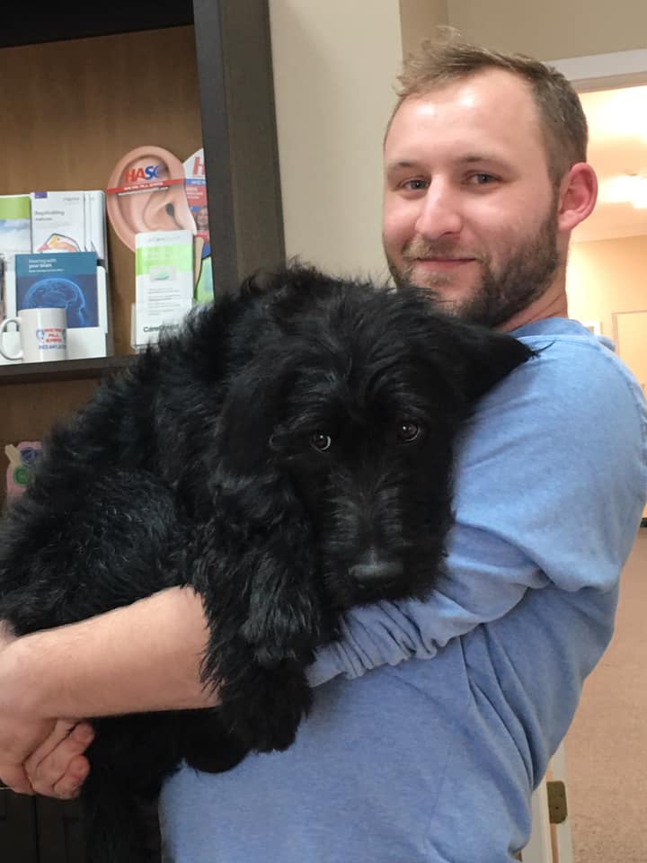 Staff of Hearing Associates of South Carolina - Aiken with black dog