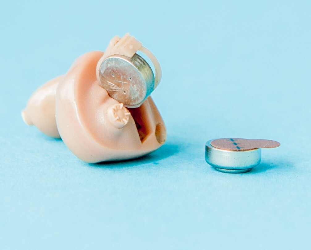 button batteries inside a hearing aid