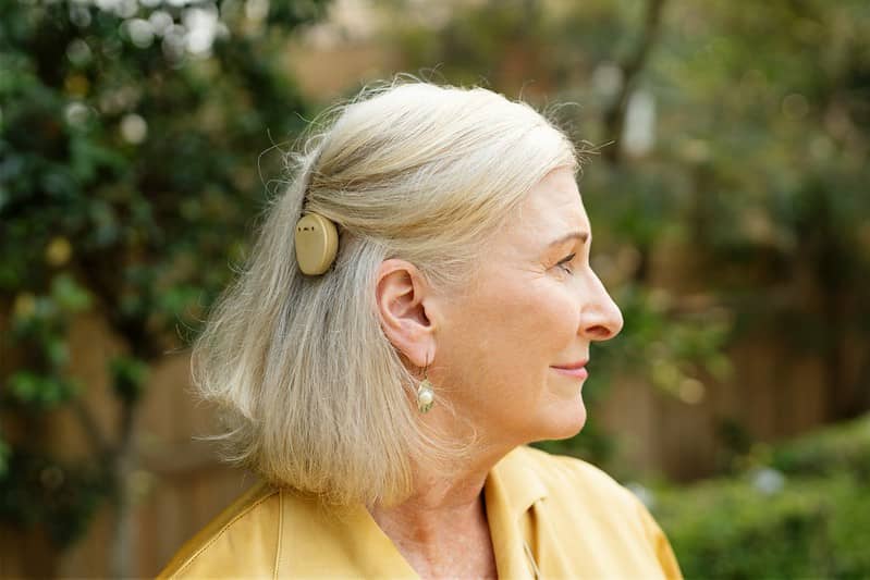 A woman with a Kanso cochlear implant.
