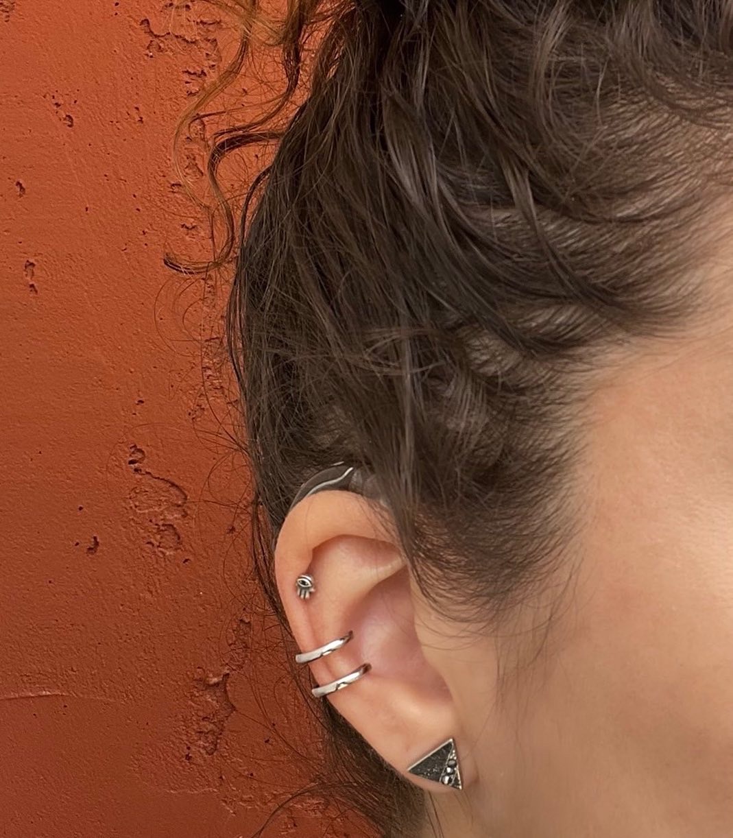 DeafMetal safety ring on a woman's ear